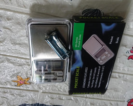 Mini electronic weighing scale with LCD.